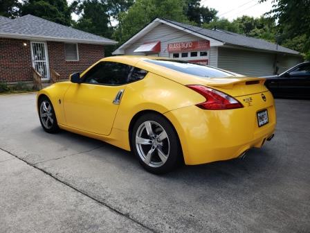 Yellow Nissan 370Z with premium ceramic window tint and windshield protection by Glass Tiger Tinting Loganville